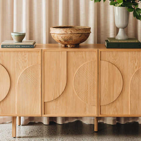 Solid oak sideboard with Art Deco design elements from the Arc Collection, featuring intricate circular patterns and elegant display pieces.