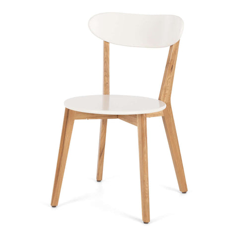 Radius white oak dining chair with curved back, angled view