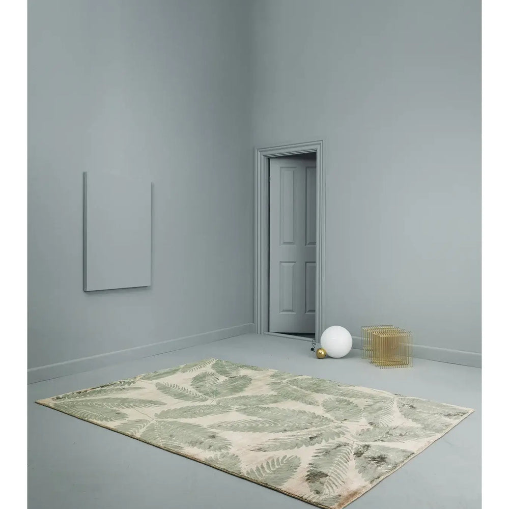Ambrosia Rug by Linie Design in minimalist room, showcasing Nordic craftsmanship and design with subtle patterns and muted tones.