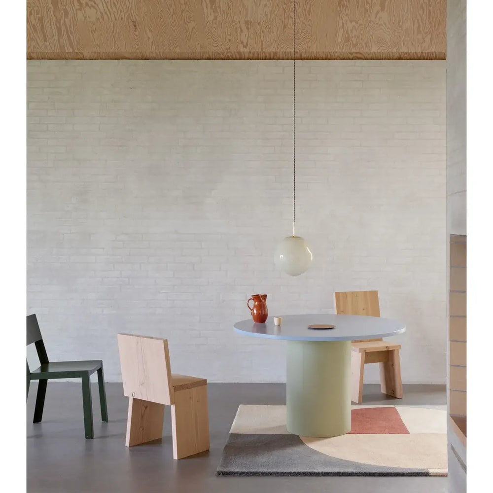 
                      
                        Modern dining room with minimalist furniture and Linie Design Radiality Rug, featuring Danish design and Nordic aesthetics.
                      
                    