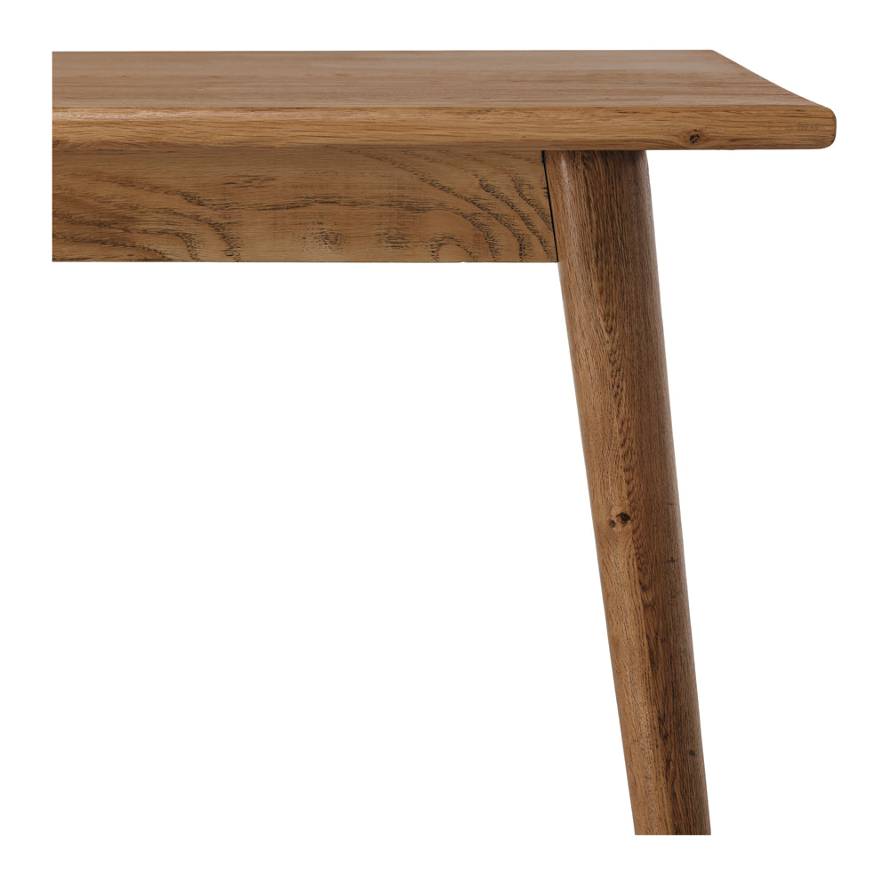 
                      
                        Reeves Dining Table in solid smoked oak with natural grain and tapered legs, showcasing elegant and durable design.
                      
                    