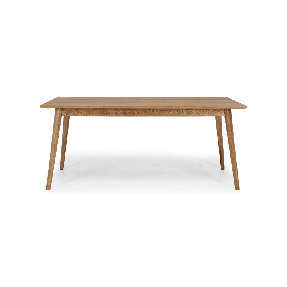 
                      
                        Reeves Dining Table in solid smoked oak with tapered legs, showcasing natural grain and elegant design.
                      
                    