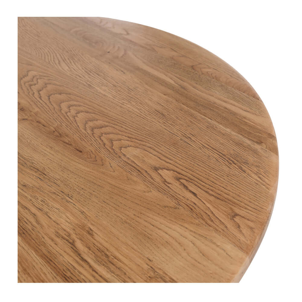 
                      
                        Close-up of the Reeves Dining Table, showcasing the solid smoked oak surface and its natural grain pattern.
                      
                    