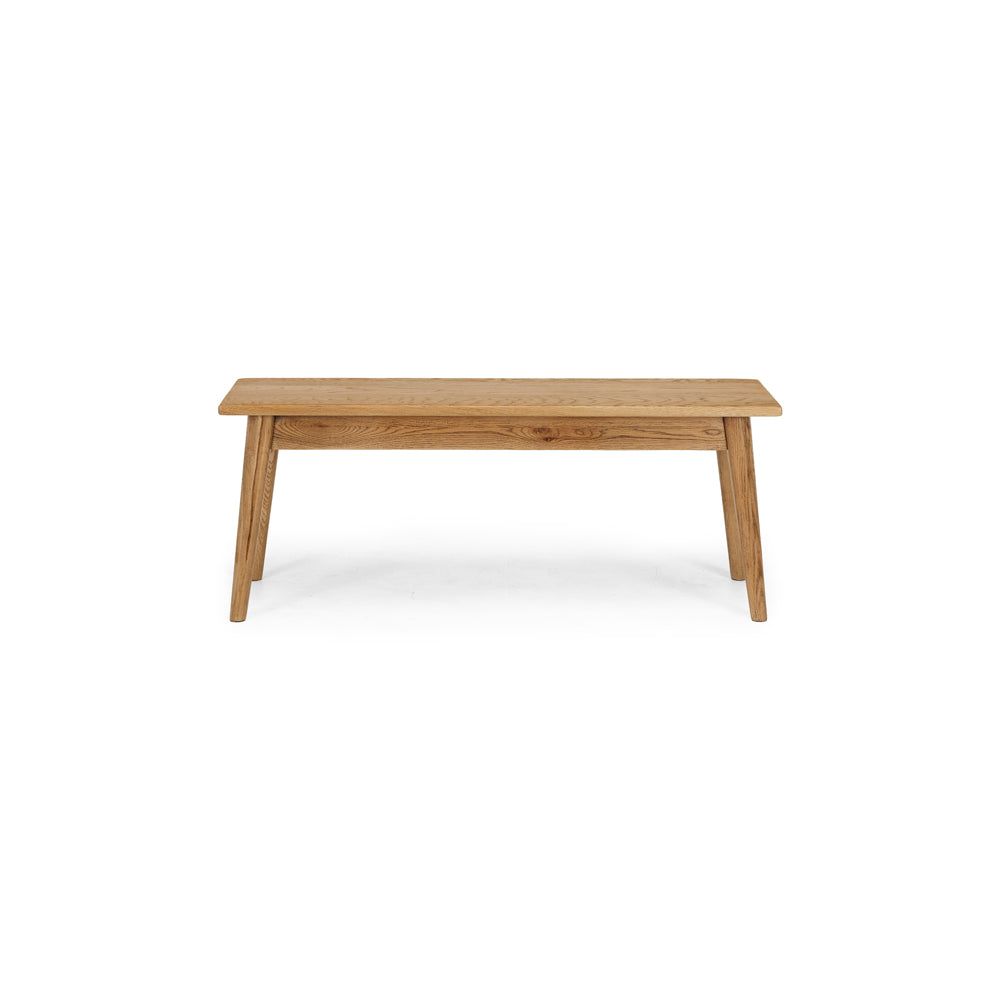 
                      
                        Reeves Dining Bench in solid smoked oak with natural grain and tapered legs; smooth polished finish for style and durability.
                      
                    