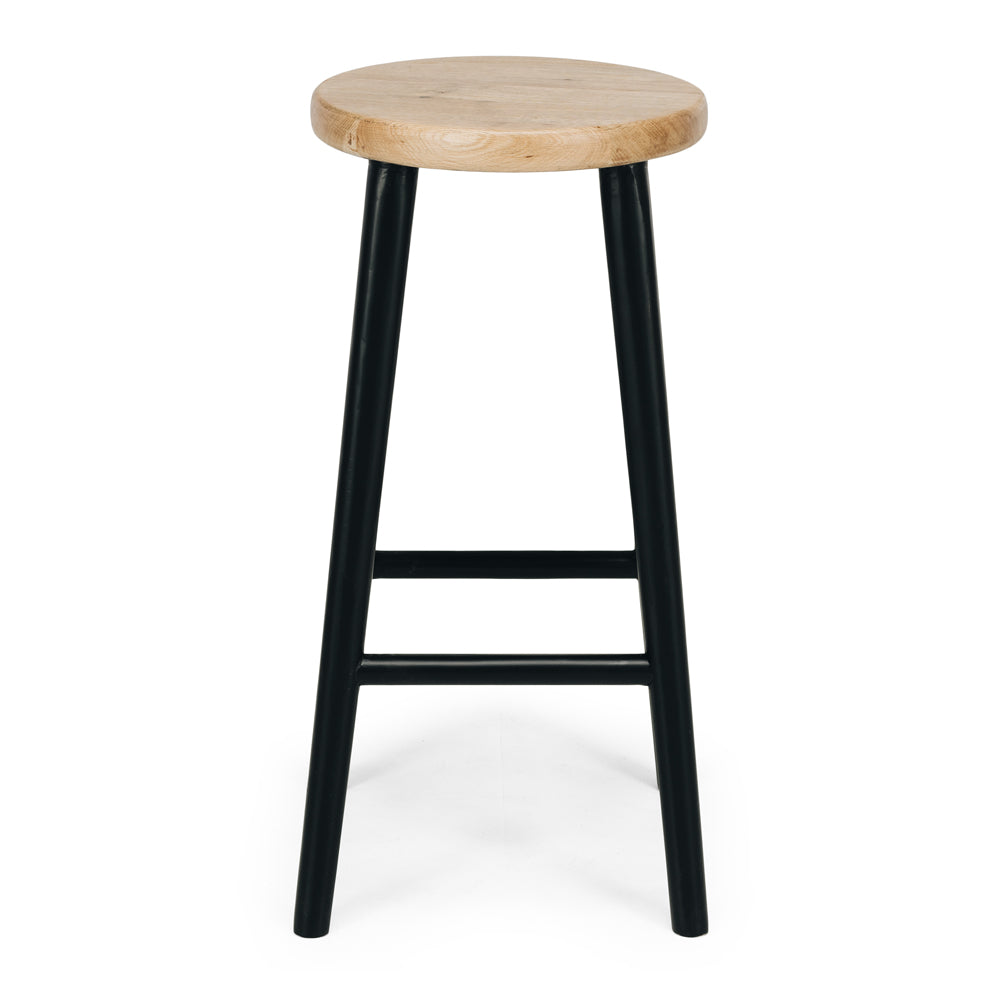 Rye Oak Bar Stool in Rustic Black with round seat and sturdy legs, ideal for compact spaces and featuring natural wood grain.