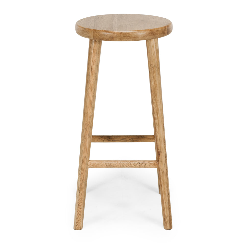 Rye Bar Stool in natural oak with round seat and sturdy legs, designed for compact spaces and everyday comfort.