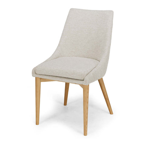 Fog Eva upholstered dining chair, angled front view on a white background