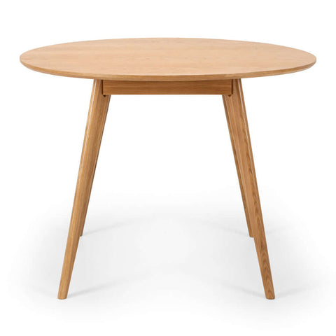 Radius round oak dining table, angled front view