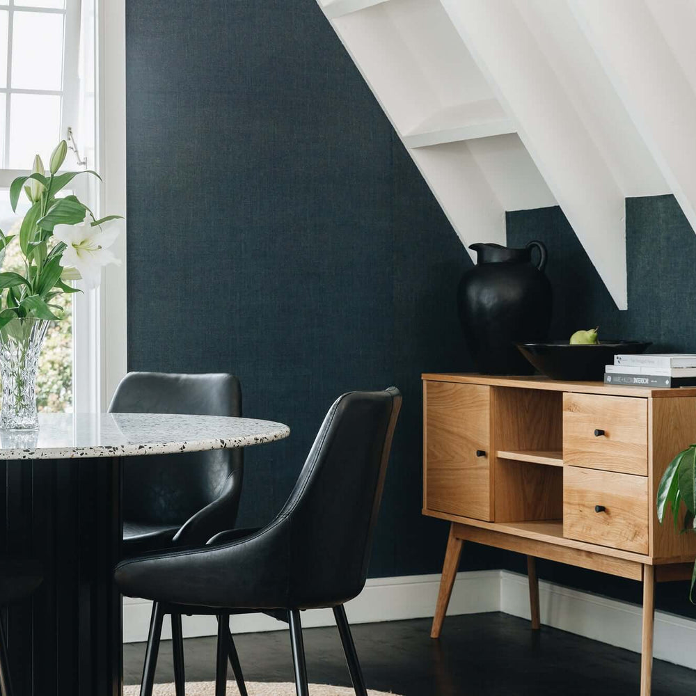 
                      
                        Radius Sideboard in natural oak, Scandinavian design in modern dining room with round marble table and black chairs, styled with plants and decor.
                      
                    