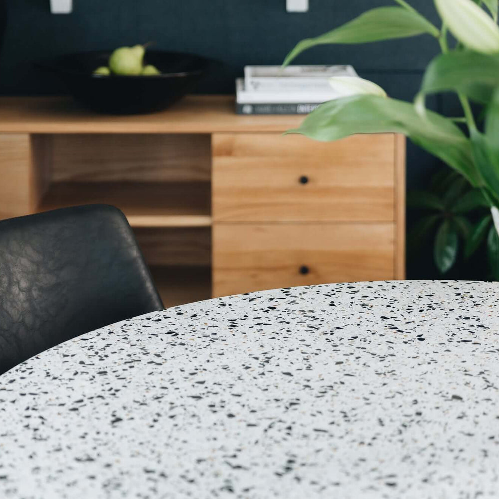 
                      
                        Scandinavian design dining area with terrazzo table, greenery, and Radius oak sideboard.
                      
                    
