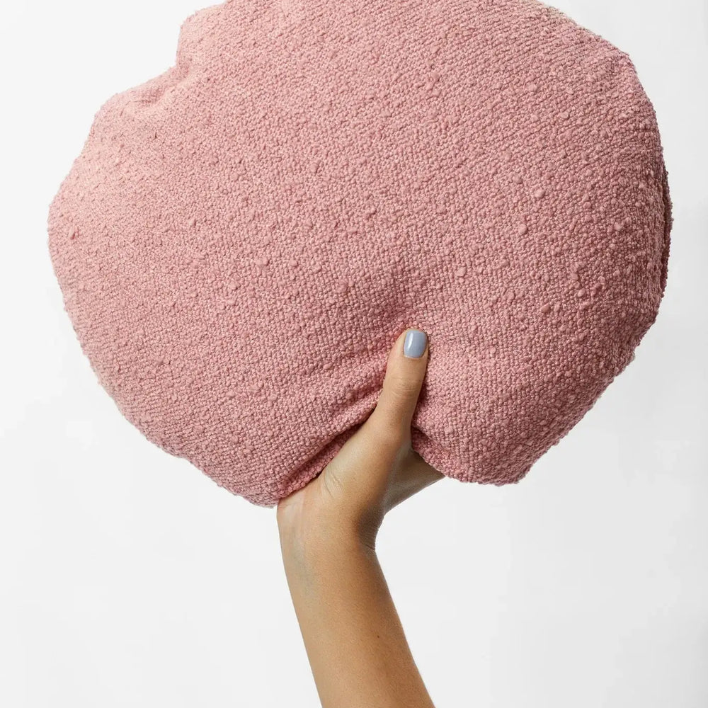 
                      
                        Hand holding blush Junior Boucle cushion by Hommey, 40cm diameter, 95% polyester 5% acrylic, cozy and stylish home decor piece.
                      
                    