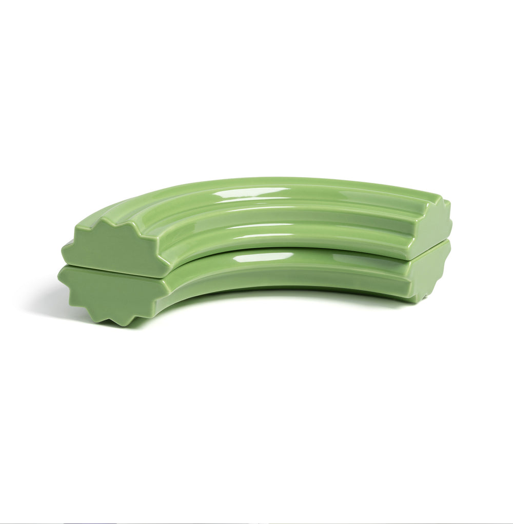 Green ceramic churros box with a sleek design, perfect for storing small items, highlighting playful decor.