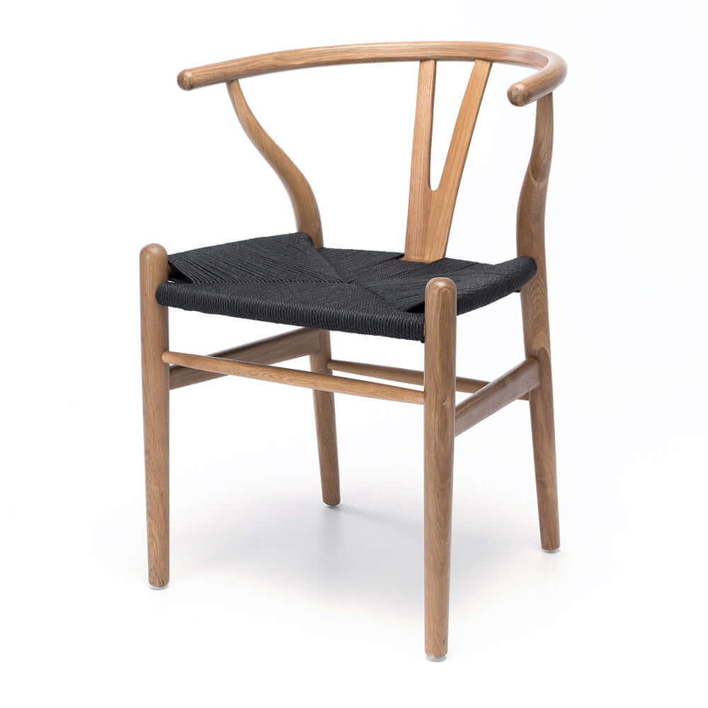 
                      
                        Replica Hans Wegner Wishbone Dining Chair with natural woodgrain, steam-bent back, and black rope seating, mid-century design.
                      
                    