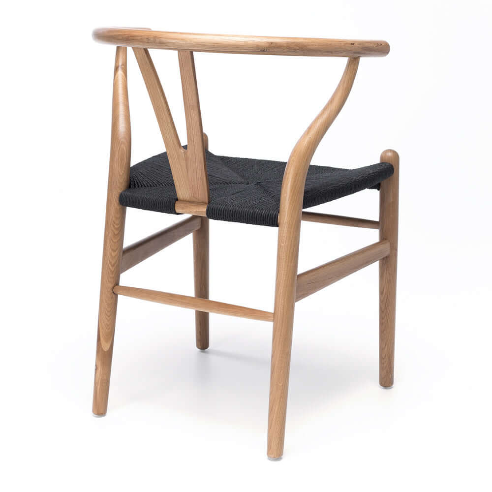 
                      
                        Oak Wishbone Dining Chair with black rope seat, showcasing mid-century design and natural woodgrain elegance. Replica Hans Wegner chair.
                      
                    