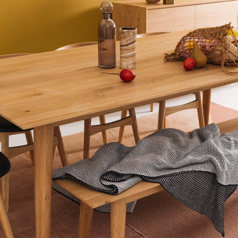 Nordik oak dining table with oak bench in dining room closeup