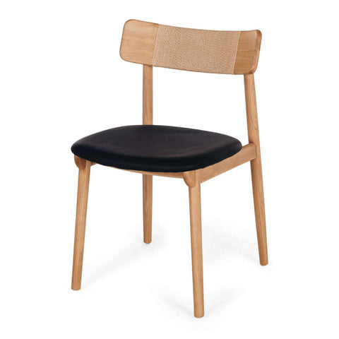 Niles natural oak dining chair with black PU seat, angled front view
