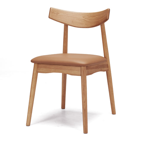 Natural oak dining chair with a tan upholstered seat and curved backrest on a white background, shown from an angled view